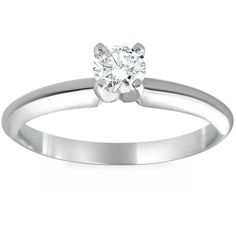 a white gold ring with a single diamond