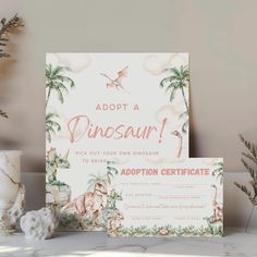 a dinosaur themed birthday party with pink and green accents, including a card that says adopt a dinosaur