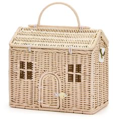 a wicker bag with a house on the front