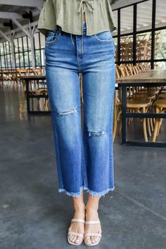 Unleash your inner fashion rebel with the Emmalyn Frayed Ankle Crop Jeans. These dark denim dreamers feature a high rise for a flattering fit, while the wide legs and frayed hem add a touch of edginess. Light distressing adds a nonchalant vibe to complete the look. Who says jeans have to be boring? General Info: 65% Cotton, 32% Polyester, 1.5% Viscose, 1.5% Spandex Machine Wash Cold; Tumble Dry Low Frayed Hem Cropped Wide Legs High Rise Light Distressing Denim Model Info: Height: 5’10” | Bust: 3 Distressing Denim, White Jumpsuit Dress, Straight Ankle Jeans, Plus Size Outerwear, Ankle Boots Flat, Sporty Girls, Crop Jeans, Wide Legs, Ankle Jeans