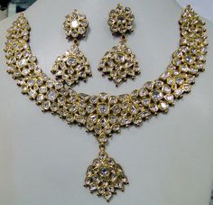 "22 carat solid gold, Old cut Diamonds and multicolor Enamel work necklace (Kundan Meena choker)with Matching Earrings. A large necklace Ideal for special occasions set with eye popping clear old cut genuine Diamonds. A solid piece of jewelry good for family Heirloom which will last for ever. Multicolor enamel at the back giving this piece a unique look of quality, great workmanship and great value for Money. Length of necklace -23 cm (9.05\") Size could be adjusted according to your requierment Gold Kundan Necklace With Rose Cut Diamonds, Traditional Gold Necklace With Rose Cut Diamonds, Traditional Gold Necklaces With Rose Cut Diamonds, Gold Kundan Jewelry With Rose Cut Diamonds, Hand Set Yellow Gold Kundan Necklace For Festivals, Hand-set Yellow Gold Kundan Necklace For Festivals, Festive Gift Kundan Necklace With Rose Cut Diamonds, Festivals Gift Kundan Necklace With Rose Cut Diamonds, Festival Gift Kundan Necklace With Rose Cut Diamonds