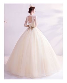 Buy Luxe Champagne Gold Ballgown Wedding Dress With Half Sleeves Embroidery at wholesale price online. Free shipping and pro custom service since 2009. Beige Ball Gown For Wedding, Wedding Gown In Gold Tulle, Gold Ball Gown Wedding Dress For Quinceanera, Gold Tulle Wedding Gown, Elegant Gold Wedding Dress For Quinceanera, Gold Wedding Ball Gown, Gold Ball Gown Wedding Dress, Wedding Dress With Half Sleeves, Gold Ballgown