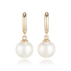 Our exclusive earrings feature white freshwater pearls playfully dangling from yellow gold huggie hoops. Since 1861, Gump's has been a destination for distinctive jewelry that offers a lifetime of enjoyment. To ensure each piece is created to our exacting standards, our expert in-house jewelry team oversees every step of the production process. The result is a statement of pure elegance. White freshwater cultured pearls, 9mm. 14-karat yellow gold. Pierced only. 1" long. Exclusive Earrings, Pure Elegance, White Freshwater Pearl, Freshwater Cultured Pearls, Cultured Pearls, Production Process, Pearl White, Soho, Freshwater Pearls