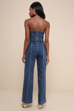 Influence the crowds left and right with a flawless look like the Rare London Pretty Iconic Medium Wash Denim Strapless Wide-Leg Jumpsuit! Slightly stretchy, cotton-blend denim shapes this impressive jumpsuit with a straight neckline and a strapless, fitted bodice. The figure-fitting silhouette features constrasting stitching and seam detailing that continues into wide pant legs with full-length hems. Exposed silver zipper at the back. Fit: This garment fits true to size. Length: Ankle length. S Chic Strapless Denim Jumpsuits And Rompers, Fitted Denim Strapless Jumpsuits And Rompers, Strapless Fitted Denim Jumpsuits And Rompers, Strapless Fitted Denim Jumpsuits, Strapless Denim Blue Summer Jumpsuit, High Rise Stretch Denim Jumpsuit, Stretch High Waist Denim Jumpsuit, Fitted Wide Leg Denim Jumpsuit, Casual High-rise Fitted Strapless Jumpsuit