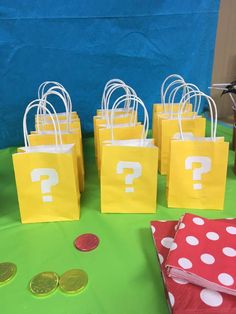 bags with question mark on them sitting on a table