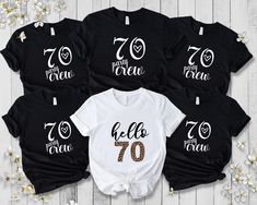 four personalized shirts with the number 70 on them