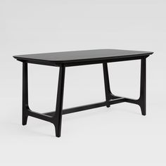 a black table sitting on top of a white floor