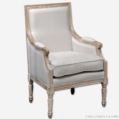 an old fashioned chair with white upholstered fabric