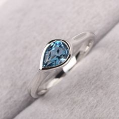 ◆ The ring is handcrafted from sterling silver and decorated with a dazzling 7*5 mm London blue topaz. It is suitable for engagement/anniversary/daily occasion. ◆ Production Description: Main stone Type: Real London blue topaz Main Stone Shape: Pear Cut Main Stone Size: 7*5 mm(0.96ct) Side stone: None Metal: 925 Sterling silver - Other options available in the drop down menu ◆ Customization: √Free for Add Engraving √Other Metal Type Available √Other Gemstones & Shapes Available √Personalization Sterling Silver Teardrop Topaz Ring For Anniversary, Anniversary Teardrop Topaz Ring In Sterling Silver, Blue Topaz Teardrop Promise Ring, Silver Teardrop Blue Topaz Ring, Anniversary Blue Topaz Teardrop Ring, Anniversary Teardrop Blue Topaz Ring, Elegant Teardrop Topaz Ring In Sterling Silver, Teardrop Silver Topaz Ring In Sterling Silver, Silver Sterling Silver Teardrop Topaz Ring