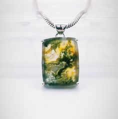 A beautiful handmade creation of Moss Agate Stone Pendant with Solid Sterling 925 Silver. We make our jewelry with fine quality of workmanship and high quality semi precious stones. This Beautiful Moss Agate Stone is from . This is a beautiful handmade creation.  Link for more Moss Agate Pendants - https://www.etsy.com/in-en/listing/1575071937/moss-agate-pendant-925-sterling-silver?click_key=b8c96c816df4e420e8d29bfcd1739ecc0d51af7b%3A1575071937&click_sum=2d135056&ref=shop_home_active_1&pro=1&frs Nature-inspired Agate Jewelry For Gifts, Ocean Jasper Gemstone Jewelry For Gifts, Silver Moss Agate Jewelry Gift, Silver Moss Agate Jewelry For Gift, Silver Moss Agate Jewelry As A Gift, Spiritual Agate Jewelry With Polished Finish, Ocean Jasper Gemstone Pendant Jewelry, Ocean Jasper Gemstone Pendant, Adjustable Moss Agate Gemstone Jewelry