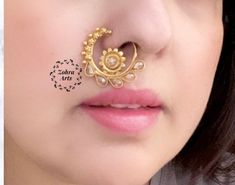 "weight: 0.1 oz Around 1\" (round) Height = 30 mm || Width = 25 mm Classic Nose Ring Antique Nose Ring Indian Bridal Traditional One Gram Jewelry Indian Nose Ring does not require a hole in the nose. This Nose Ring is pressable (no piercing is required ) and worn on the left side .. Gorgeous 24 K gold plated. This Nose ring is designed for all special occasions. it requires NO piercing , just press it and you are done. the size of the nose ring is approximately the size of a Cent. CARE: Keep jew Bridal Nose Ring Indian, Nose Ring Indian Wedding, Nose Ring Indian, Bridal Nose Ring, Ring Indian, Ring Clip, Indian Nose Ring, Jewellery Sketches, Nose Jewelry