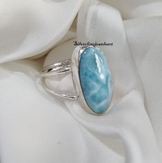 Natural Larimar Ring, Spilt Band , Gemstone Ring, 925 Sterling Silver, Handmade Ring, Gift For Her, Big Oval Gemstone, Blue Larimar, Gift, Material: 925 Solid Sterling Silver Gemstone: Larimar Stone Shape: Oval This One of a kind ring is adorned with beautiful Larimar Gemstone in sterling silver band. About gemstone-Larimar is known as Dolphin stone .Larimar is a crystal of serenity, clarity ,radiating healing and love energy. As a Water element stone Larimar cools hot tempers, calms fear, relie Larimar Ring, Larimar Rings, Larimar Jewelry, Larimar Stone, Sterling Silver Bands, Pearl Studs, Gemstone Ring, Rings Statement, Sterling Silber