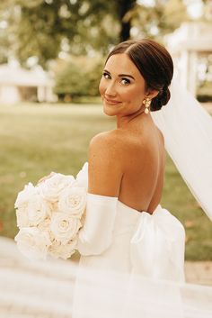 Sleek Full Bridal Updo with White and Gold Earrings with all White Bridal Bouquet and Satin Gloves Low Bun Bridal Hair, All White Bridal Bouquet, Bridal Updo With Veil, Low Bun Wedding Hair, Bride Hairstyles Updo, Classic White Wedding, Bride Details, Bride Updo, Satin Gloves