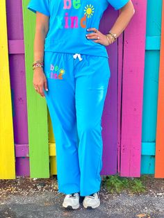 Be Kind Light Blue Scrub Pants Fun Stretch Bottoms With Elastic Waistband, Playful Blue Pants With Pockets, Playful Relaxed Fit Bottoms With Pockets, Fun Blue Cotton Bottoms, Playful Stretch Blue Bottoms, Navy Blue Scrubs, Scrubs Outfit, Rainbow Tee, Trendy Tees