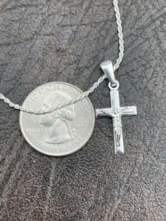 "Men's, Women's, Boy's, Girl's Small Crucifix Pendant SOLID 925 SILVER with natural finish or 14k yellow gold vermeil Very high polished diamond cut so its very shiny and clean to the eye Solid sterling silver underneath so never changes color or tarnishes. Nice detail Cross weighs around 1.5 grams Measures 0.75\" by 0.5\" (1\" w bale) Great small size for men or medium for ladies You can buy cross only or with a 2mm rope chain (chain is also silver and made in Italy) IF YOU WANT THE CROSS ONLY, Classic Engraved Crucifix Jewelry, Classic Crucifix Jewelry With Polished Finish, Classic Polished Crucifix Jewelry, Classic White Gold Crucifix Jewelry, Classic Hallmarked Crucifix Jewelry, Sterling Silver Crucifix Jewelry For Formal Occasion, Anniversary Crucifix Jewelry With Polished Finish, Silver Crucifix Jewelry Stamped 14k, Cross Pendant For Men