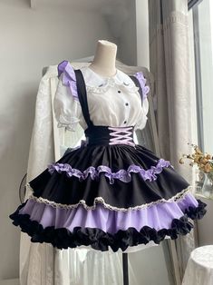 This stunning Lolita skirt features a charming black and purple color scheme, accentuated by a lace-up front and a high waist design for a flattering fit. The detachable straps add a versatile touch, allowing you to customize your look. Embrace the sweet and elegant Lolita style with this beautiful skirt that is perfect for any occasion.   	 		 			Size 			S 			M 			L 		 		 			Waist 			58-82 			64-88 			72-94 		 		 			Full Length 			43 			44 			45 		 		 			Hem Circumference 			426 			426 			426 Purple Clown Outfit, Purple Maid Dress, Purple Idol Outfits, Pretty Dresses Purple, Black Ruffled Bottoms For Cosplay, Purple Fitted Skirt For Cosplay, Fitted Purple Skirt For Cosplay, Fitted Purple Skirt For Costume, Black Costume Skirt With Attached Cancan