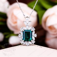 "Jewelry Details -Gold Type:  Solid 18K Gold / Solid 14K Gold  (Choose One in Material Option) -Center Stone: Lab Created Emerald 8*10mm, Approximately 3.24ct Color: Green--- 5A Clarity: VVS Cut: Emerald Cut / 3EX -Side Stone: 1.86cttw moissanite Color: EF Clarity: VVS1 Cut: Round Cut, Marquise Cut -Pendant Width: 15.6mm -Pendant Height: 25mm -Chain Length: 40+3+3cm SKU: YP0068 ~*-*~Purchase Guarantee: - All our jewelry is handmade, and each process is refined. - 14 Day Refund Guarantee. - All our products are Free Shipping. - Free Gift Box&Packing. ~*-*~Please contact us if you need service: 1. Ring Resizing. 2. Metal Change(PT950/10k/14k/18k White/Yellow/Rose Gold). 3. Engraving ring (less than 10 letter). 4. Accept customization. We believe that our quality, attention to detail, design Exquisite Emerald Necklace For Anniversary, Luxury Diamond Cut Emerald Necklace For Anniversary, Luxury Emerald Cut Emerald Necklace For Anniversary, Emerald Pendant Design, Luxury Hallmarked Emerald Necklace For Wedding, Exquisite Emerald Necklace For Formal Occasions - May Birthstone, Exquisite Emerald Necklace For Formal Occasions And May Birthstone, Exquisite Formal Emerald Necklace For May Birthstone, Luxury Cubic Zirconia Emerald Necklace For Anniversary