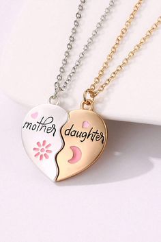 This magnetic heart necklace set is perfect for moms and daughters to show their love for each other. The two pieces fit perfectly together and can be easily separated, just like the bond between a mother and daughter. Crafted with a stylish white design, this necklace set will make a heartwarming gift for any special occasion. Mother Daughter Necklace, Heart Necklaces, Daughter Necklace, Delicate Design, Watches Women Fashion, Mother And Daughter, Heartfelt Gifts, Top Gifts, Matching Necklaces