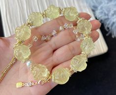 Material:Citrine Quartz beads, The metal hardware is 14k gold-plated and inlaid with zircon. size :Approx 15mm   quantity: one strand  6mm approx 29 pcs one strands 7mm approx25 pcs one strands 8mm approx 22 pcs one strands 9mm approx 21pcs one strands 10mm approx 19 pcs one strands 11mm approx 18pcs one strands 12mm approx 16 pcs one strands 13mm approx 16 pcs one strands 14mm approx 15 pcs one strands 15mm approx 14pcs one strands 16mm approx 14 pcs one strands 17mm approx 13pcs one strands 18 Gold Beaded Bracelets With Gemstone Accents, Elegant Gold Citrine Crystal Bracelet, Elegant Yellow Crystal Bracelet With Round Beads, Gold Citrine Round Beads Crystal Bracelet, Yellow Citrine, Quartz Beads, Unique Gemstones, Lemon Yellow, Metal Hardware