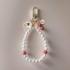 This "Take a Gamble" keychain is a fun way to make a statement everywhere your keys go! Keychain comes with three charms - a personalized letter of your choice with white background and gold letter, an alloy pair of small red dice, and cute ace playing card charm. There is also a stylish light-weight handmade pearl loop with two red glass beads. The light gold clip makes this keychain versatile and perfect for backpacks, purses and bags. Pearl band is "stretchy" to adjust to most wrist sizes. Th Iphone Keychain, Ace Playing Card, Las Vegas Style, Red Dice, Unique Keychain, Vegas Style, Unique Keychains, Gold Letter, Gold Clips