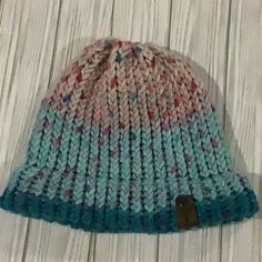 Handmade Knitted Multicolored Blue Winter Hat, It’s Made By Me The Hat Is Made With A Multicolored Yarn That Includes Pink Blue And Turquoise Colors. It Comes From A Smoke Free Home. Blue Knit Beanie For Cold Weather, Colorful Casual Winter Hats, Casual Blue Acrylic Yarn Hat, Casual Colorful Winter Hats, Blue Soft Knit Beanie For Cold Weather, Blue Knit Winter Hat, Casual Pink Beanie One Size, Casual Blue Knitted Hat, Blue Knit Beanie One Size