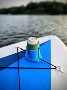 a can is sitting on the edge of a boat