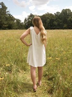 This is a white sleeveless v neck dress with a ruffle detail on the shoulder. The model is wearing a size small Sleeveless V Neck Dress, White Sleeveless, The Model, V Neck Dress, Graduation Dress, Clothes For Sale, Neck Dress, White Dress, Dress Outfits