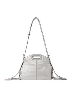 Find MAJE Miss M Mini Bag on Editorialist. The Maje Miss M Mini Bag is crafted from leather and features a top handle and an adjustable shoulder strap. The bag is accented with silver tone hardware and fringes. The bag has a flap open closure. It also has a buckle closure. The bag is fully lined with polyester and is perfect for carrying your essentials. Silver Top Handle Shoulder Bag With Detachable Strap, Silver Shoulder Bag With Top Carry Handle, Silver Satchel Shoulder Bag With Top Carry Handle, Silver Leather Top Handle Shoulder Bag, Silver Leather Shoulder Bag With Detachable Handle, Silver Satchel With Adjustable Strap And Top Handle, Silver Handheld Satchel With Detachable Strap, Designer Silver Satchel With Detachable Strap, Handheld Leather Shoulder Bag With Palladium Hardware