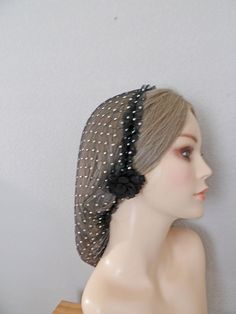 We have made this to be adjustable with no tight elastic.    Hand Washable.  Dry flat.  Dries fast.   Our net caps are designed for women to protect even the most luxuriant locks.  Keeps hair under control fashionably. The amount of drag at the back depends on how much hair you have inside the net.   We handcraft our head coverings one-by-one in our Oceanside, CA studio. .Thank you for visiting our shop today! Hair Snood Pattern, Adjustable Black Hair Accessories For Wedding, Face Net Veil, Black Adjustable Hair Accessories For Wedding, Adjustable Rhinestone Hair Accessories For Weddings, Hair Net Pattern, Adjustable Wedding Headpieces With Rhinestones, Adjustable Rhinestone Headband For Evening, Adjustable Rhinestone Headband For Wedding