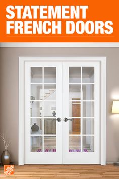 an orange sign that says statement french doors in front of a room with hardwood floors