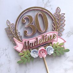 a cake topper with the number 30 on it