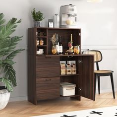 an office desk with shelves and drawers in front of a potted plant on the floor