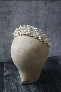 a headpiece with pearls and beads on it