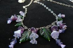 Spring breezes purple wisteria necklace, created with Czech pressed glass beads, long sterling silver chain and a sterling silver  adjustable flower clasp. Unique Purple Dangle Necklaces, Purple Czech Glass Dangle Jewelry, Nickel-free Purple Czech Glass Jewelry, Purple Wisteria, Leaves Necklace, Violet Flowers, Violet Flower, Bib Necklaces, Necklace Statement