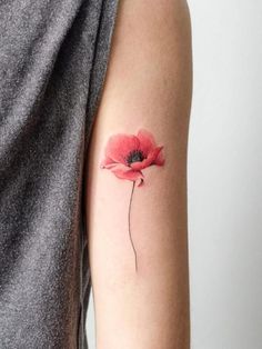 a single red flower on the left arm