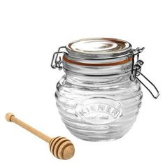 Kilners Glass Honey Pot Set is the perfect gift for the honey lover in your life. Reminiscent of days past, this vintage-style ridged glass honey pot features a sweet swing-top lid with gasket to provide an air tight seal, ensuring your honey stays free of any contaminants. The beech wood dipper will provide just the right amount of honey drizzled in your afternoon tea. This jar is also perfect for homemade jams, jellies or chutney. Spoil that honey lover in your life with Kilners Glass Honey Pot Set! FEATURES: Vintage-style ridged glass jar Swing-top lid with rubber seal Airtight seal Ideal for honey, jams, jellies or chutney Beech wood dipper Dimensions: 4.92H x 5.31W x 3.94D Capacity: 13.5-ounces Made in China Item #: 0025.887 Click Here for More Kilner Products! Color: Multicolor. Pickled Fruit, Kilner Jars, Honey Dipper, Kitchen Food Storage, Honey Jar, Honey Pot, Pot Sets, Kombucha, Mason Jar Mug