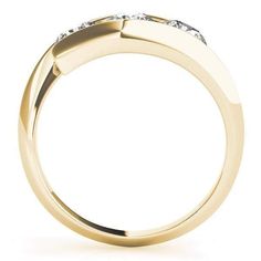 a yellow gold ring with three diamonds on it