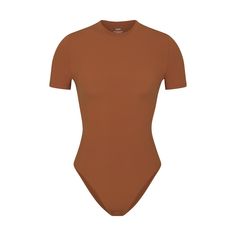 Like your favorite tee, but better! This molds-to-your-body short sleeve bodysuit features a buttery soft fabric, high crew neckline, and brief back for a comfortable fit. Snap closures make it easy to get on and off. Tshirt Bodysuit, Color Bronze, Short Sleeve Bodysuit, Orange Brown, Shapewear, Crew Neckline, Soft Fabric, Soft Fabrics, Comfort Fit