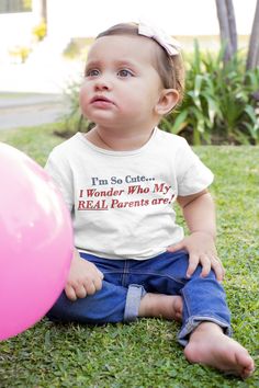 I'm So Cute, I Wonder Who My Real Parents Are. Funny baby and toddler t-shirt. Get laughs and gasps when you present this gift to new parents.  It makes a fun baby shower gift or toddler birthday present. Or get it for your own baby or grandbaby. Have some fun! See more funny t-shirts from Pearl's Country Store here: https://www.etsy.com/shop/PearlsCountryStore?section_id=42007630 HOW TO CARE FOR YOUR TEES:  *Wash inside out with like colors.  *Tumble dry low or hang to dry.  *Don't iron directly over the design. This t-shirt features side seams to better support the garment's shape, these tees also come with ribbed knitting for improved durability and taped shoulders for a breezy fit. Solid colors are 100% soft ring-spun cotton, but heather colors include polyester. 100% Combed ring-spun Cute Letter Print T-shirt For Playtime, Funny First Birthday T-shirt, First Birthday Short Sleeve T-shirt With Text Print, First Birthday T-shirt With Text Print, Short Sleeve T-shirt With Text Print For First Birthday, Funny Short Sleeve Tops For Playtime, Cute Letter Print Top For First Birthday, Funny Letter Print T-shirt For First Birthday, Cute Top With Name Print For First Birthday