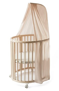 a baby crib with a canopy over it