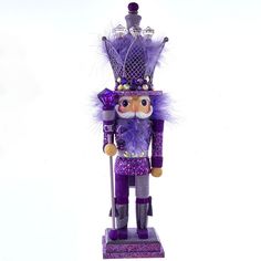 Add a touch of glam to your holiday decorations with this Kurt Adler Hollywood purple King nutcracker. Add a touch of glam to your holiday decorations with this Kurt Adler Hollywood purple King nutcracker. Glittery purple detailsDETAILS 3.5"H x 4"W x 16"D Weight: 2.25 lbs. Solid wood, wood comp, paint/mic, iron Spot clean Imported Gift Givers: This item ships in its original packaging. If intended as a gift, the packaging may reveal the contents. Size: One Size. Gender: unisex. Age Group: adult. Purple Nutcracker, King Nutcracker, Purple King, Purple Gemstones, Nutcracker Christmas Decorations, Christmas Nutcrackers, Jewel Top, Purple Feather, Purple And Silver