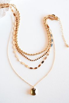 The Emily Layered Chain Necklace is a stunning accessory that effortlessly combines glamour and sophistication. This necklace features multiple layers of delicate gold chains, elegantly cascading around the neckline. Each layer is adorned with clear or topaz crystal drop, adding a touch of sparkle and allure. The combination of the crystals and the layered chains creates a captivating and dynamic look. The Emily Layered Chain Necklace is perfect for those special occasions when you want to make Topaz Crystal, Chain Necklace Gold, Layered Chain Necklace, Layered Chain, Necklace Ideas, Multi Layer Necklace, Layered Chains, Gold Necklace Layered, Layering Necklace