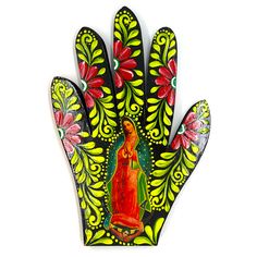 a hand painted with an image of the virgin mary on it's palm is shown against a white background