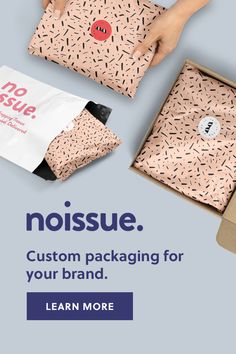 a woman's hand is opening a box with the words no issue, custom packaging for your brand learn more