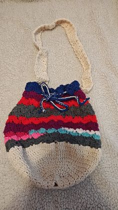 This is a handmade Purse made with acrylic and cotton yarn It's a cute tote bag with shoulder straps that can be removed  If you have questions  Please let me know Cute Multicolor Handmade Crochet Bag, Cute Handmade Cotton Shoulder Bag, Multicolor Crochet Bucket Shoulder Bag, Multicolor Crochet Bag With Adjustable Strap Gift, Cute Handmade Crochet Bag For Everyday, Gift Multicolor Crochet Bag With Adjustable Strap, Handmade Cute Cotton Shoulder Bag, Cute Handmade Crochet Bag For Everyday Use, Handmade Multicolor Crochet Bag