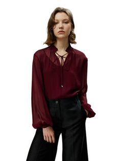 The tone is reminiscent of a full-bodied red wine. The particularly light georgette creates an elegant, mysterious silhouette with its subtle sheerness. The drawstring at the tie collar and the delicate ruffles at the hem imbue the elegant temperament with a touch of freedom. 10MM Soft and Semi-sheer Georgette Regular Fit Popover neckline with tie front drawstring Can be worn alone or with camisole Silk Tops For Women, Georgette Tops, Tie Collar, Georgette Blouse, Silk Pajama Set, Blouse Nordstrom, Silk Pajamas, Tie Blouse, Work Wardrobe