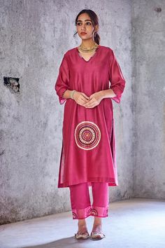 Dark pink kurta with mirror embroidered placement motif.
Component: 1
Embroidery
Neckine: V neck
Sleeve Length: Three fourth
Fabric: Chanderi
Color: Pink
Kutch hand embroidery
Scallop hem on sleeves
Side slits
Note: Pant and dupatta worn by model are not for sale. - Aza Fashions Embroidered V-neck Salwar Kameez For Festive Occasions, Chanderi Kaftan With Mirror Work For Festivals, Traditional Unstitched V-neck Kurta, Festival Chanderi Kaftan With Mirror Work, Traditional Embroidered V-neck Palazzo Set, Festive Chanderi Kaftan With Mirror Work, Festive Chanderi V-neck Kurta, Festive V-neck Kurta With Zari Work, Festive V-neck Chanderi Kurta