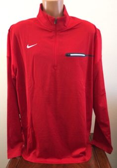 We love to combine shipping!  ~ Nike ~  Men's 1/2 Zip Pullover Shirt Style: 746960 - Color: 658 Red - Size: 2XL ~ Brand New with Tags ~ Mock neck 100% Polyester exclusive of decoration Dri-FIT helps pull sweat away to keep you dry and comfortable 1/2 zip Front left chest zip pocket Armpit to armpit measures approx. 27" Armpit to end of sleeve approx. 21.5" Armpit to hem approx. 19.25" Back neck seam to hem approx. 30.5" Side neck seam to end of sleeve approx. 33.25" I want my Nike Casual Top In University Red, Nike University Red Long Sleeve Tops, Red Long Sleeve Sports T-shirt, Casual Half-zip Sports Tops, Casual Long Sleeve University Red T-shirt, University Red Long Sleeve Casual T-shirt, Casual University Red Long Sleeve T-shirt, Casual Red Sports Tops, Casual Long Sleeve Sports Shirt