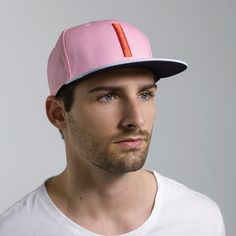 The Blinky is a classic six-panel, baseball-style cap in pink with a contrasting light blue brim and raised embroidery detail in orange. All March Caps feature top eyelets and an adjustable snap-back closure. Each cap comes with a hand-numbered card signed by the designer. Pink Fitted Hat With Flat Brim, Pink Flat Bill Snapback Hat For Sports, Pink Trucker Hat For Sports, One Size, Pink Trucker Hat For Sports, One Size Fits Most, Pink Flat Bill Sports Hat, Pink Adjustable Flat Cap, Adjustable Pink Flat Cap, Pink Snapback Hat For Streetwear With Flat Brim, Pink Flat Brim Trucker Hat For Streetwear