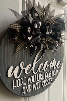 a welcome sign hanging on the front door